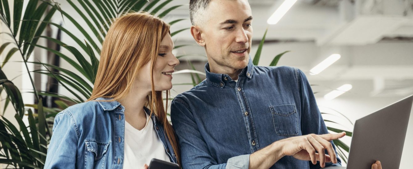 man-showing-something-laptop-his-coworker man-showing-something-laptop-his-coworker